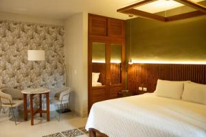 Postel nebo postele na pokoji v ubytování Hotel Poquito a Poquito