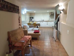 a living room with a couch and a table at Casa el Sereno in Salas Bajas