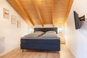 Postel nebo postele na pokoji v ubytování Bayerwaldchalet 2