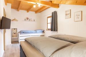 Postel nebo postele na pokoji v ubytování Bayerwaldchalet 2