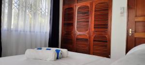 Postel nebo postele na pokoji v ubytování Royal Palms Apartment A2