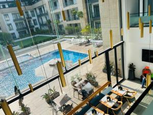 an overhead view of a swimming pool in a building at Cozy Abode by Embassy Gardens in Accra