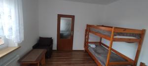 Postel nebo postele na pokoji v ubytování Apartmán AMSEL