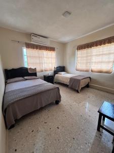 Postel nebo postele na pokoji v ubytování hostal tik hall
