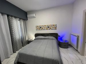 Ένα ή περισσότερα κρεβάτια σε δωμάτιο στο Carelli 9 apartments 3