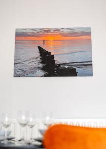 a table with a view of the ocean and a pier at Captains Quarters in Cleethorpes