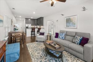 a living room with a couch and a table at Hill Country Hideout in FBGTX in Fredericksburg