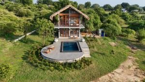 an overhead view of a house with a swimming pool at The Yala Lodge in Kirinda