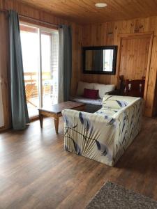 a bedroom with a bed and a table in a room at Cabañas brisas del mar Family in Los Molles