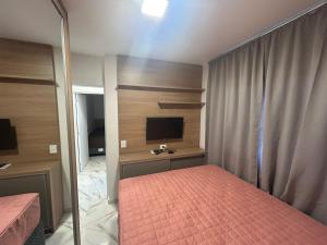 TV a/nebo společenská místnost v ubytování Apartamento no Crisalidas simplicidade e aconchego