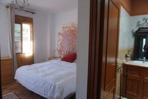 A bed or beds in a room at Accommodation Madre Amada Tenerife
