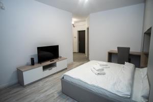 Et tv og/eller underholdning på Toka Apartments Luxury Studio