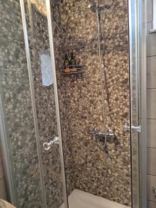 a bathroom with a shower with a glass door at Sea Sight Vibes in Frangokastello +116 photos