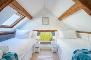 Postel nebo postele na pokoji v ubytování Crab Cottage