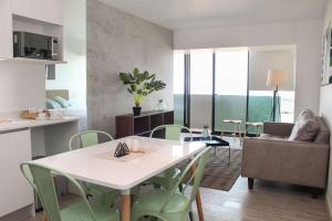 Televiisor ja/või meelelahutuskeskus majutusasutuses HOM I Espectacular Depto 1D1B, y Estacionamiento Privado PNM 1113