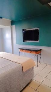 TV a/nebo společenská místnost v ubytování hotel paraiso