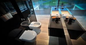 a bathroom with a toilet and a sink at Bilor Luxury Holidays in Subbiano +10 photos