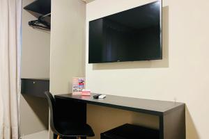 Μια τηλεόραση ή/και κέντρο ψυχαγωγίας στο Easy Suites Natal Hotel