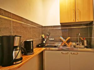 a kitchen with a coffee maker on a counter at Studio Brennerei Haselberg in Wriezen