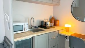 Kuchyň nebo kuchyňský kout v ubytování Frame Hotel - SoCo