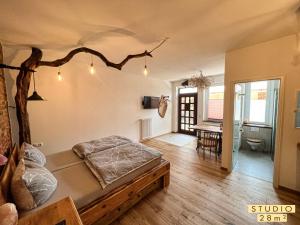 a bedroom with a bed and a table in a room at Altstadt Apartments in Neuruppin