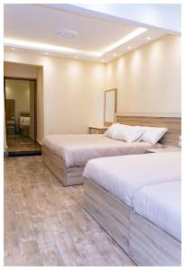 Cama o camas de una habitación en Hasan Pyramids Hotel