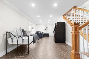a living room with a staircase and white walls at Sunset Paradise in Terrell