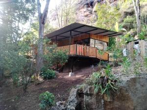 a wooden house in the middle of a forest at Era Vella in Machetá