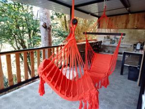 a red hammock hanging from a balcony at Era Vella in Machetá