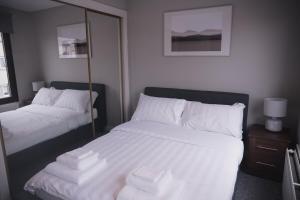 Katil atau katil-katil dalam bilik di Townhouse on the Spital