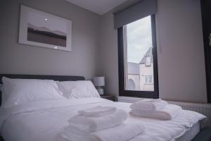 Katil atau katil-katil dalam bilik di Townhouse on the Spital