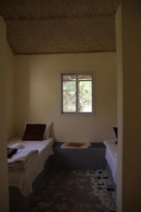 Postel nebo postele na pokoji v ubytování Asamai Rooms