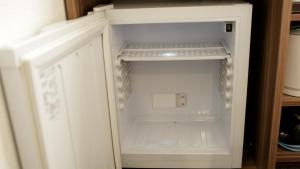 an empty white refrigerator with its door open at Tokyo Inn - Vacation STAY 26577v in Tokyo