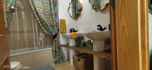 a bathroom with a sink and a shower at Wind Rose Duplex in Gran Tarajal +37 photos