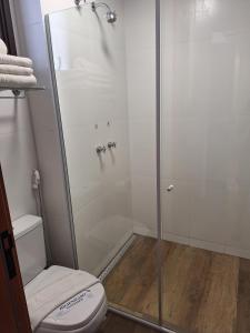 a shower stall with a toilet in a bathroom at Resort Quinta Santa Barbara in Pirenópolis +5 photos