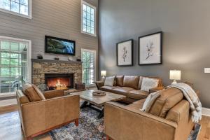 a living room with two couches and a fireplace at Big Sky - Pet Friendly Big Canoe GA Cabin-Modern amenities, hot tub, pet friendly, mountain views, access to lakes, golf courses in Afton