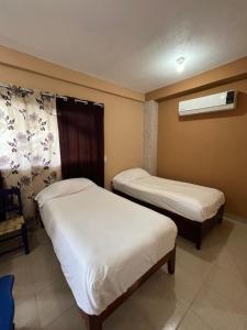 Ένα ή περισσότερα κρεβάτια σε δωμάτιο στο La Puerta del Sol