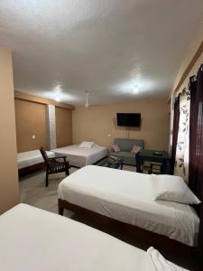 Ένα ή περισσότερα κρεβάτια σε δωμάτιο στο La Puerta del Sol +2 φωτογραφίες