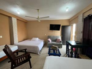 Ένα ή περισσότερα κρεβάτια σε δωμάτιο στο La Puerta del Sol