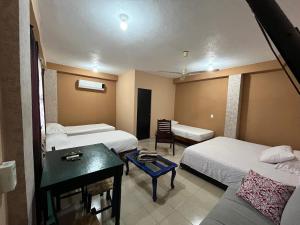 Ένα ή περισσότερα κρεβάτια σε δωμάτιο στο La Puerta del Sol