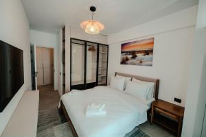 Giường trong phòng chung tại Apartament 2 camere Mamaia Nord +11 ảnh
