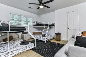 a living room with bunk beds and a couch at Robins Nest at Big Canoe - Big Canoe, GA - Enjoy Peaceful Forest Views, Rack Up a Game of Pool, and Enjoy Game Nights in the Gam in Jasper