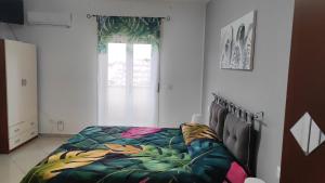 Ένα ή περισσότερα κρεβάτια σε δωμάτιο στο Bed and Breakfast Oasi