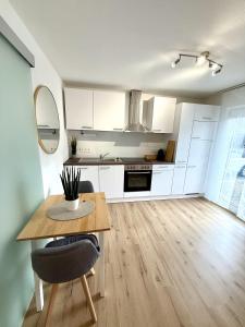 Kuchyň nebo kuchyňský kout v ubytování Das 1 Zimmer Apartment