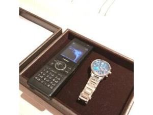 a watch in a wooden box with a cell phone at Garden Hotel Shizuoka - Vacation STAY 45844v in Shizuoka
