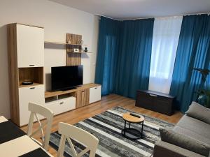 TV a/nebo společenská místnost v ubytování Apartment Nähe Messe Philharmonie, Rüttenscheid,Uniklinikum