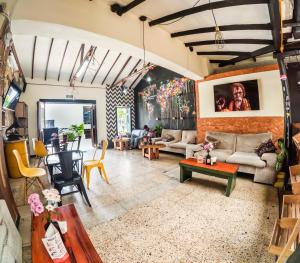 a living room with a couch and a table at Panela Hostel Poblado in Medellín
