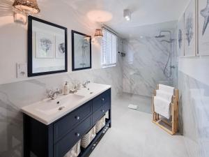 a bathroom with a sink and a shower at visit baltic - Villa Blue Marine in Świnoujście +107 photos