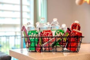 a basket full of soda bottles on a counter at Surfside Sanctuary in South Padre Island
