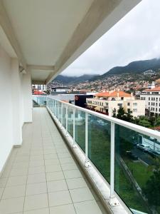 a balcony with a view of a city at Amazing Views in Machico in Machico